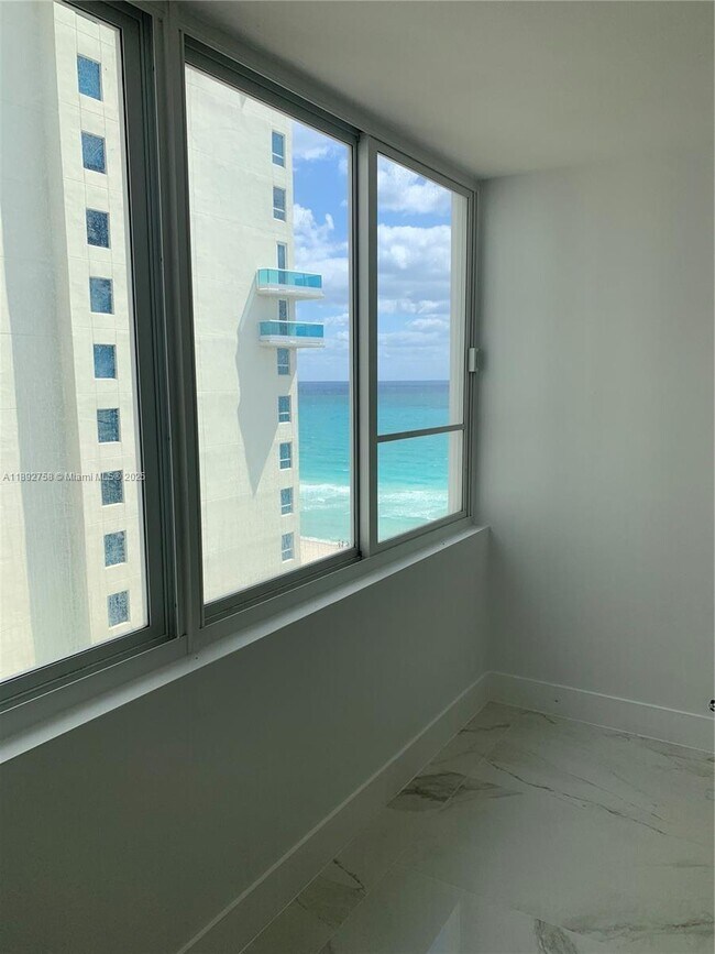 Building Photo - 5005 Collins Ave