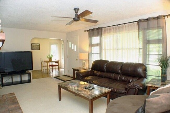 Building Photo - Corner Lot Charm: Spacious 3-Bed Home with Fireplace and Prime Location