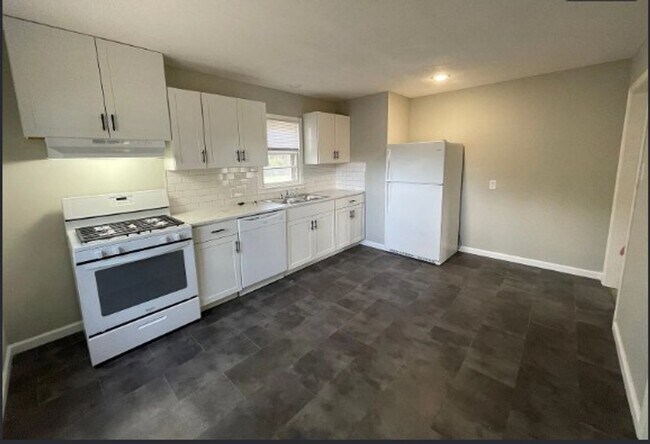 Building Photo - Welcome to Your Next Home with Harvest Investments!