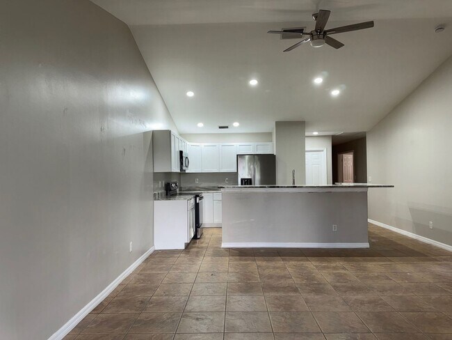 Building Photo - Experience this Cape Coral 3 bedroom 2 bath corner duplex with 1 car garage and screened in lanai.