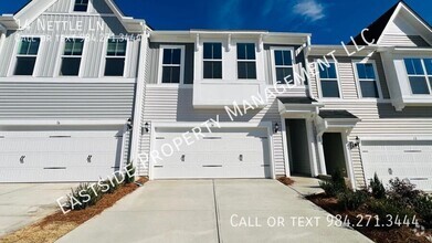 Building Photo - BRAND NEW & Beautiful Townhome with 2 car ...