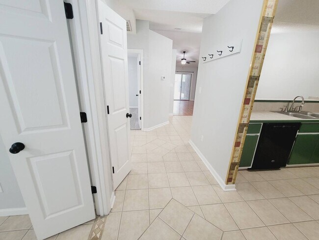 Building Photo - LOVELY 3/2 w/ Screened Porch, New Carpet in Bedrooms, Washer/Dryer, & Privacy Fenced Yard! Includ...