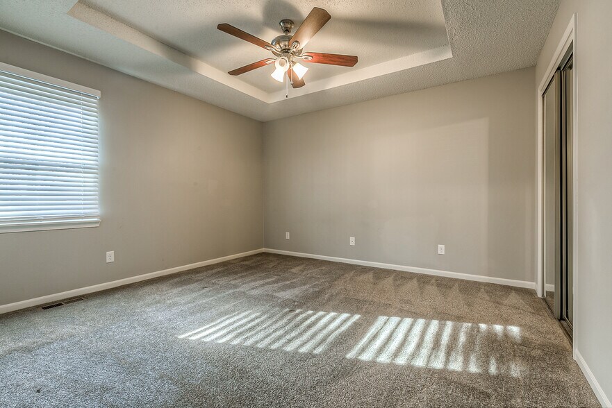 Master bedroom on 1st floor. Has ceiling fan and 2 closets with sliding doors. - 13749 W 62nd St