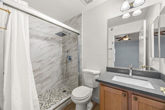 Building Photo - Charming and spacious single-story townhome nestled within a gated community in the desirable Nor...
