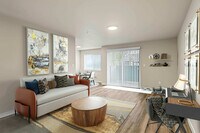 Spacious living room and dining nook in Foster Creek apartments, Tukwila, WA. - Foster Creek
