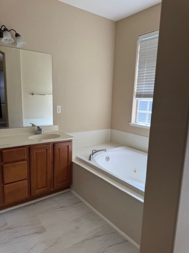 Building Photo - Located in a Quiet, Gated Community in Car...