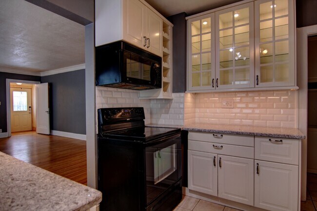 Built in wine rack to the side of the microwave - 5427 Xerxes Ave S