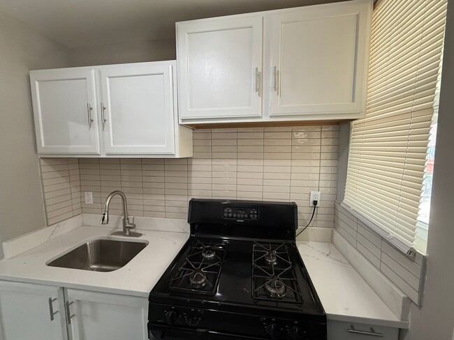 Building Photo - Renovated 2BR Home with Finished Basement ...