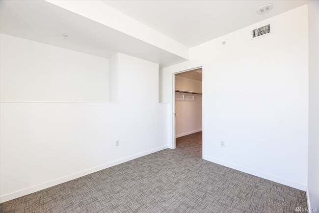 Building Photo - Spacious NW-Facing 1 Bed + Den, 1 Bath Luxury High-Rise Condo in Seattle's Denny Triangle – Nexus