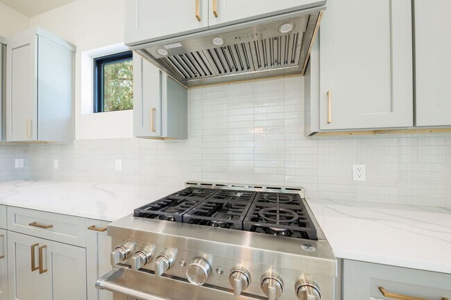 Building Photo - Luxury Redefined: Experience Vibrant Living in this 3-Bedroom Haven in East Austin