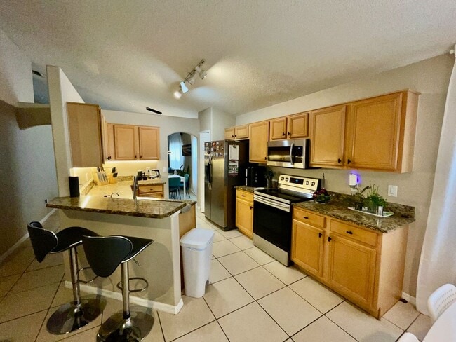 Building Photo - Modern 4-Bed, 2-Bath Solar-Powered Home Near UCF