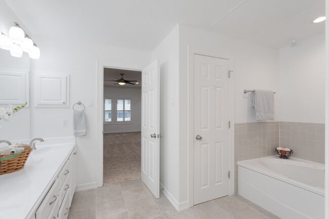 Building Photo - Gorgeous Mediterranean-style condo located...