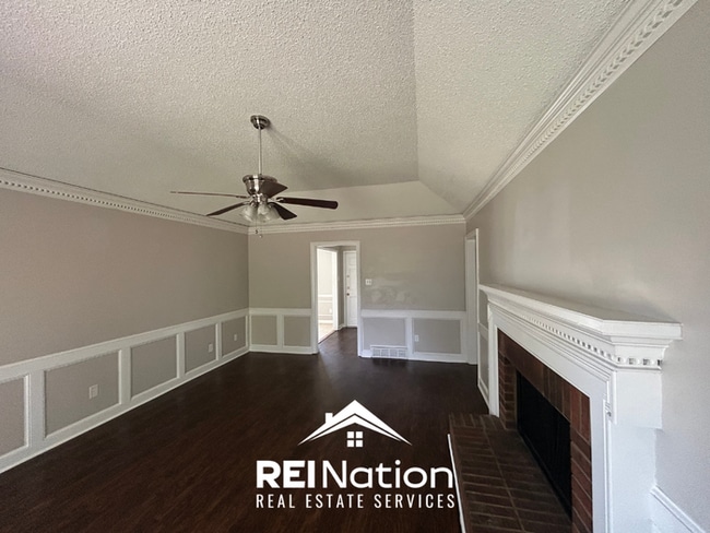 Building Photo - Spacious 4BR/2BA Near Southwind | High Ceilings, Brick Fireplace & 2-Car Garage