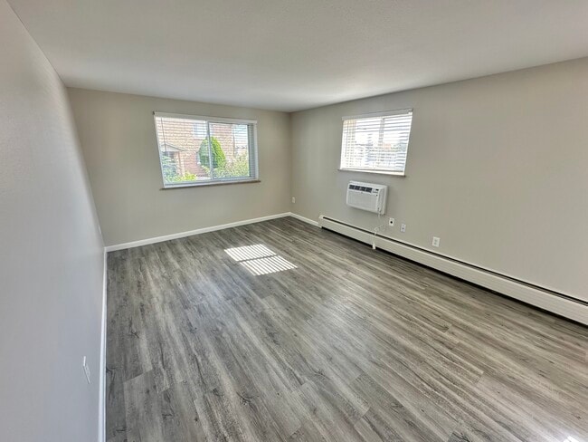 Step into this bright and airy living space, perfect for personalizing your dream home. - Allison West Apartments