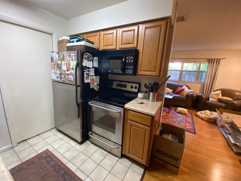 Kitchen with Stainless Steel refrigerator and oven range - 1210 E Jackson St