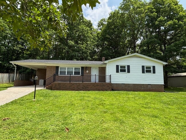Building Photo - Nice brick home, single carport, storage b...