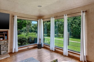 Relaxing view of golf course and greenbelt from living room window - 7300 Augusta Cir