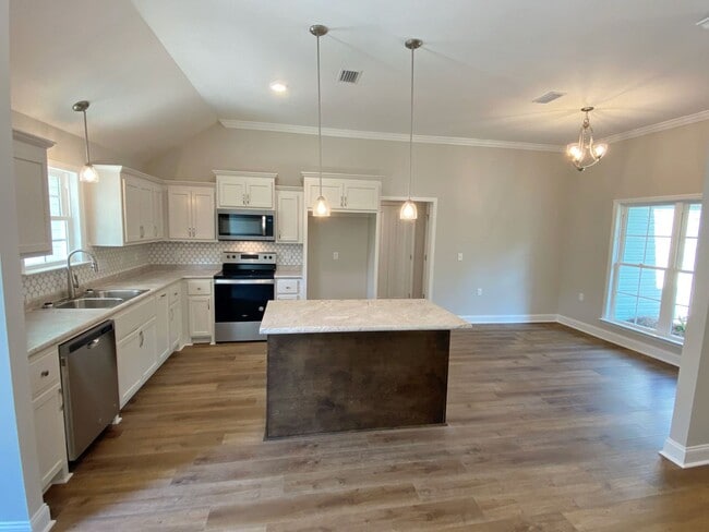 Building Photo - Modern 4-Bedroom Home with Fenced Yard Nea...