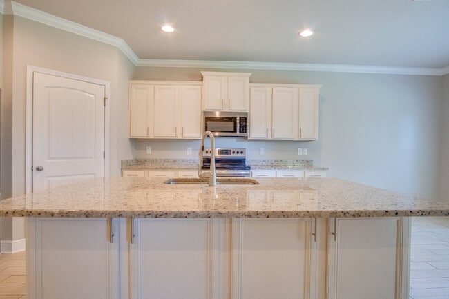 Building Photo - Spacious 4BR Pool Home with Modern Upgrade...