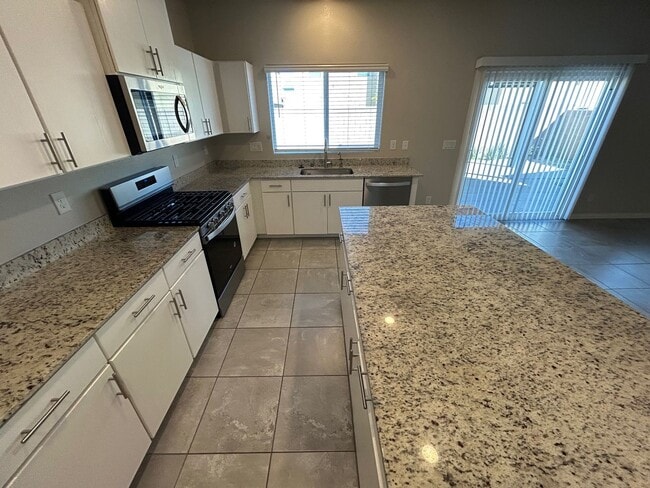 Building Photo - Gorgeous two-story home with 5 bedrooms and 3 bathrooms in a gated community