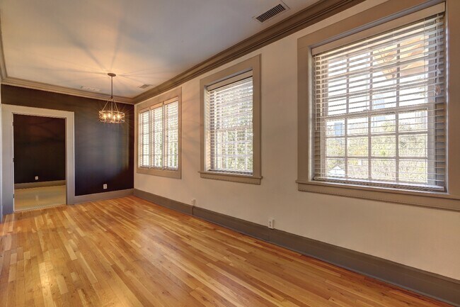Large living and dining area with wall of windows - 1 S Prado NE