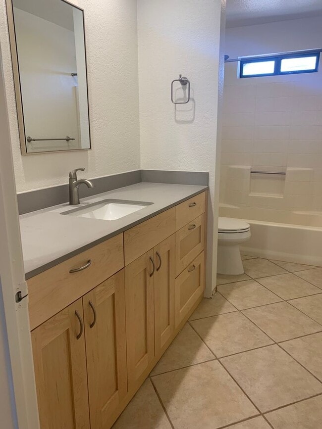 Building Photo - Four Bedroom Home with Utilities included!