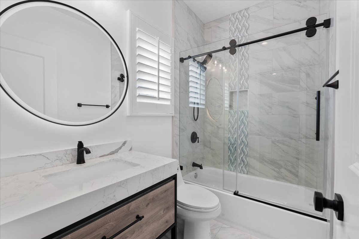 Primary restroom with custom tiles & vanity - 408 W Walnut Ave