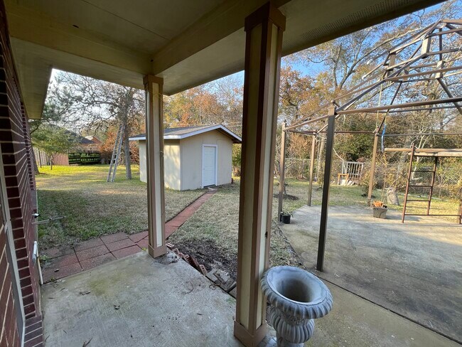 Backyard covered patio view - 600 River Bend Dr