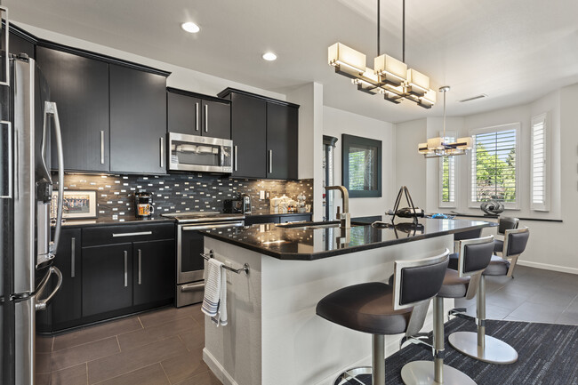 Ultra modern kitchen with breakfast bar island - 8935 E Phillips Dr