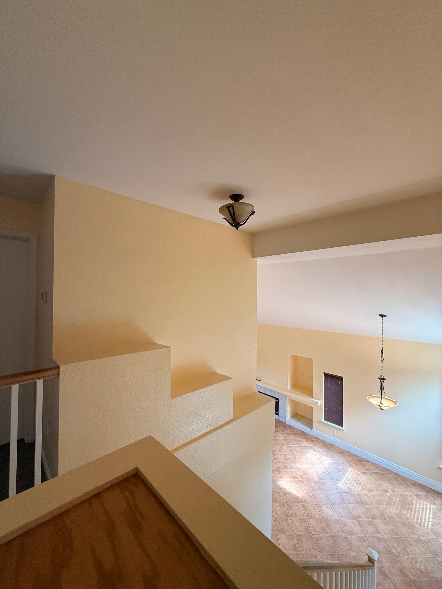 Landing looking over storage cabinet downstairs - 3326 Amberfield Cir
