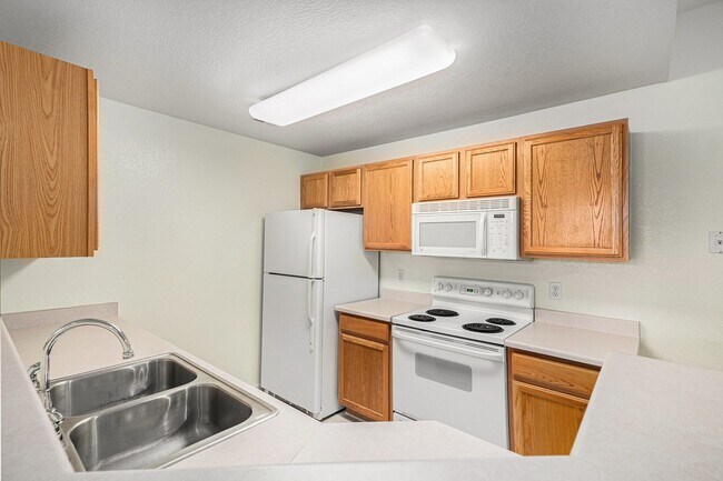 Building Photo - Bright 2-Bedroom Condo with Private Patio & Resort-Style Amenities!