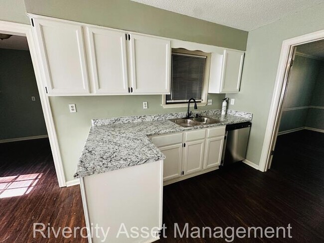Building Photo - charming three-bedroom, two-full-bath resi...