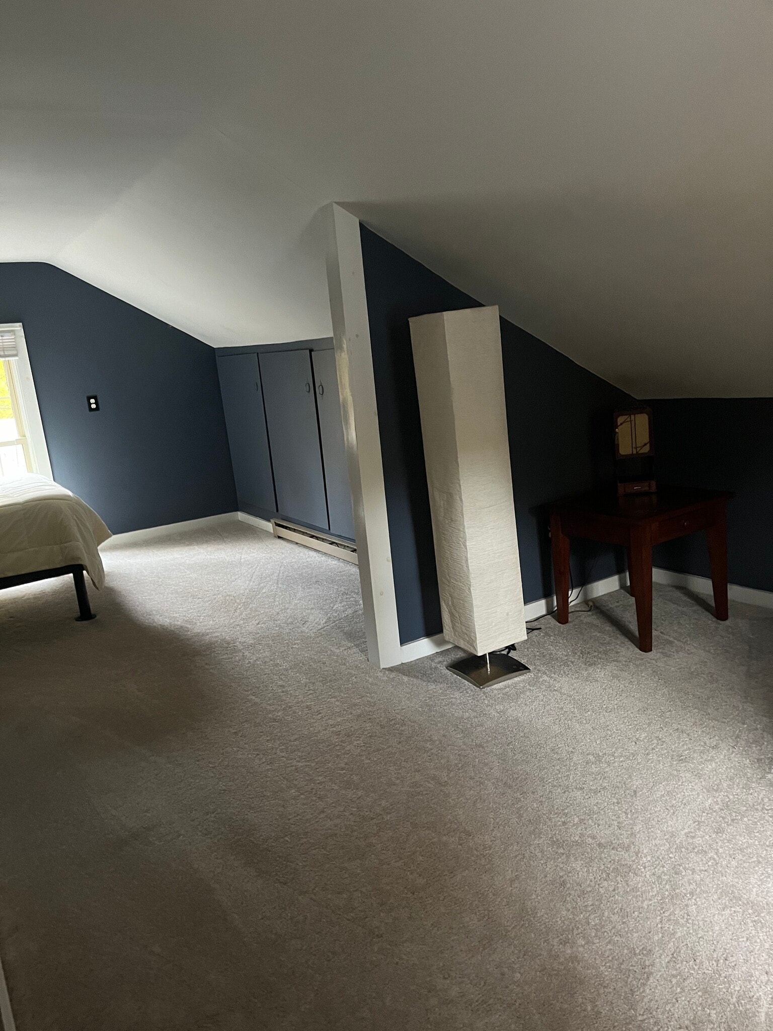 The bedroom has two vintage dressers and a desk.fir - 11 Kellogg St