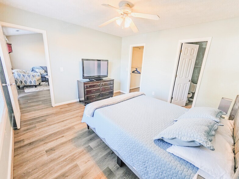 Primary bedroom has a TV - 2127 Winter Moss Ln