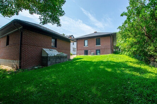 Building Photo - Adorable Brick 4 Bedroom Ranch with Finish...