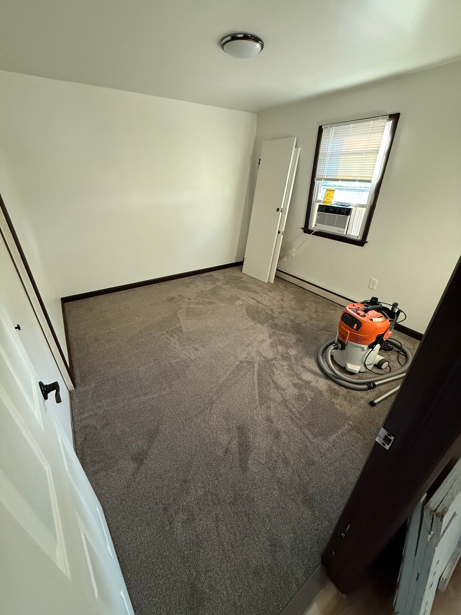 Bedroom #1 on main level. New carpet. Premium Freidrich AC unit - 6820 Rowe Dr