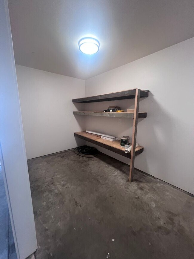 Building Photo - 2 Bedroom 1 bath house with extra large double car garage and extra storage space!