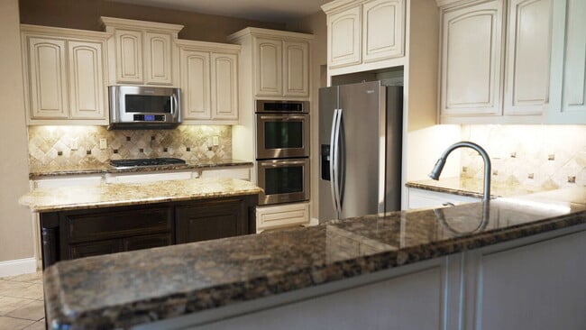 Building Photo - "Beautiful 4-Bedroom Home with Elegant Fin...