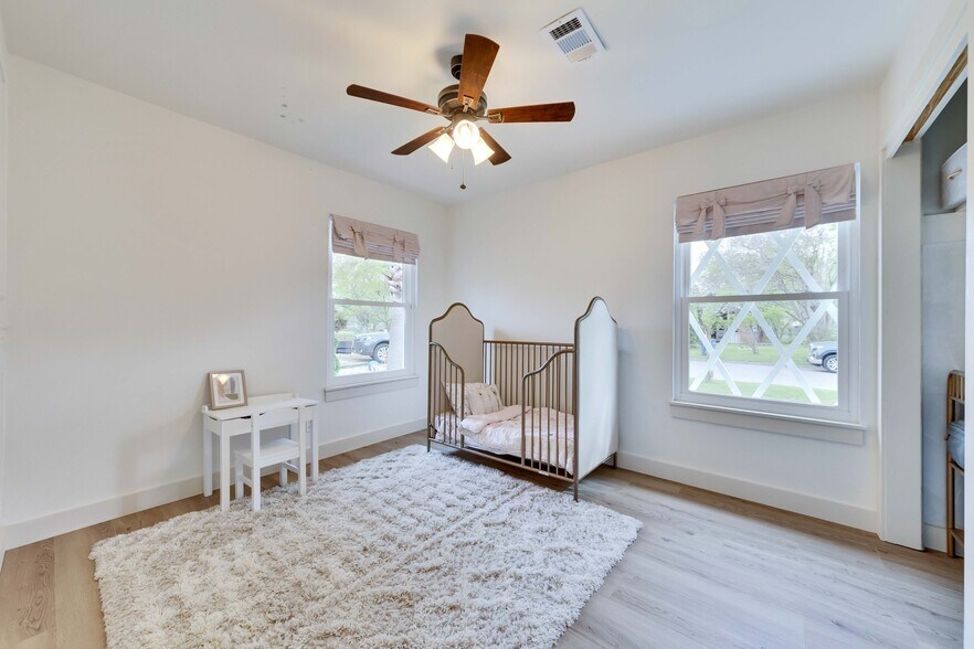 Bedroom #2, shown with furniture, gets incredible natural light from two windows & a front yard view - 2102 Bristol Dr