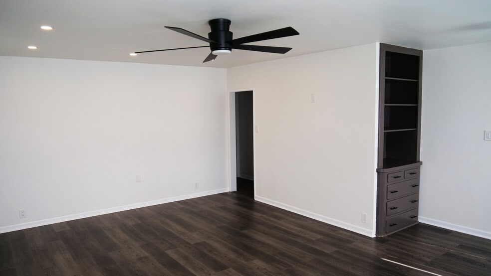 Main living space. Original built-in cabinetry. Doorway to hallway/bedrooms/bathroom. - 259 E Puente St
