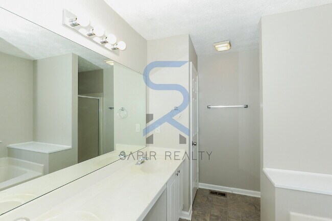 Building Photo - Move in before February 28th and choose your reward: a $250 Amazon Gift Card or a 55" Smart TV!