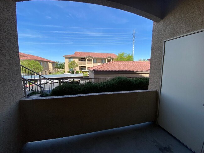 Building Photo - BEAUTIFUL CONDO IN A GATED COMMUNITY FEATURING PLANTATION SHUTTERS, TILE FLOORING AND NEW PAINT T...