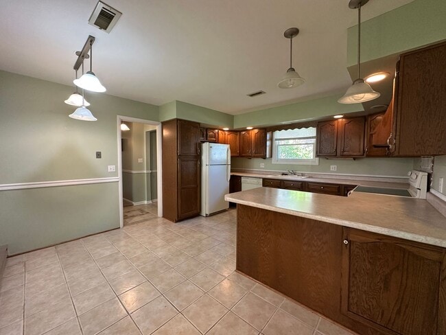 Building Photo - Not Your Typical Rental — Warm, Welcoming 3BR Brick Ranch in a Prime Neighborhood