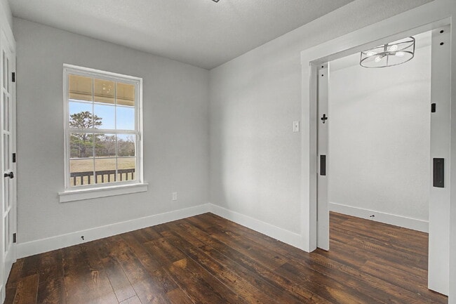 Building Photo - “4-Bedroom, 3-Bath Farmhouse Charm Meets Modern Luxury on a Serene 5-Acre Lot!”