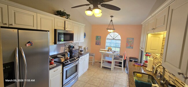 Building Photo - Welcome to **Caloosa Yacht & Racquet Club**, one of Fort Myers’ most desirable **gated waterfront...
