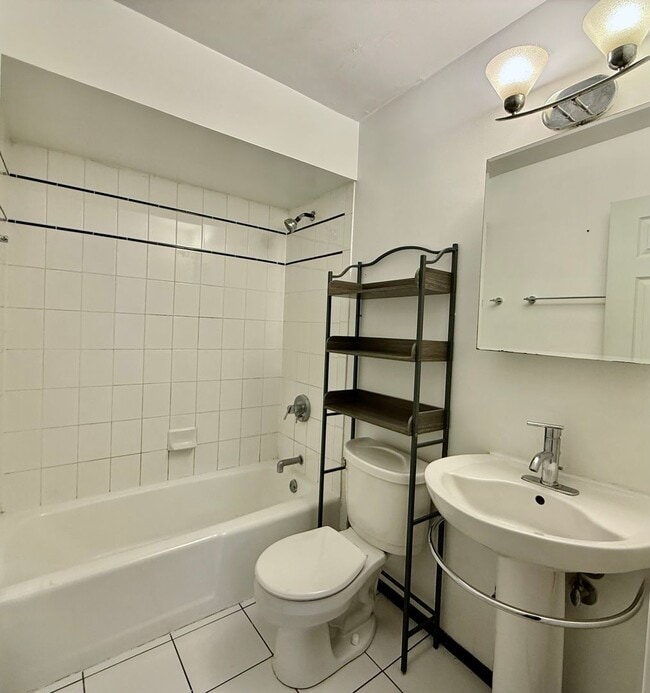 Building Photo - Pristine 2 Bedroom, 1 Bathroom Condo Available NOW! Heat, Water, & Parking INCLUDED in Rent!