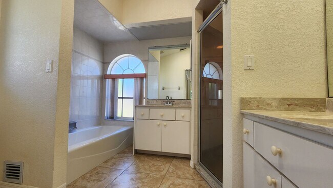 Building Photo - Fresh Paint, New Floors, and a Heated Pool...