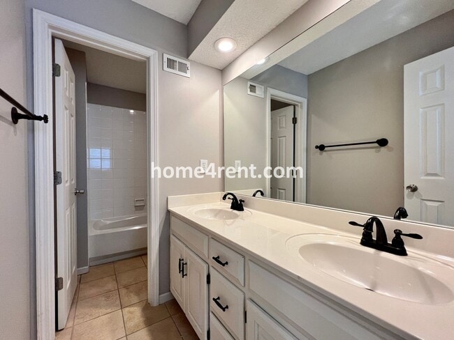 Building Photo - Updated Kitchen, Large Two Tiered Deck, Finished Basement in Blue Valley Schools!