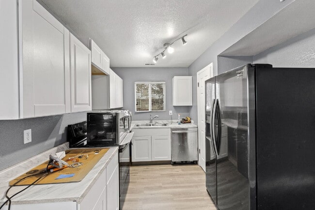 Building Photo - Charming Two-Story Home with Fenced Yard & Cozy Fireplace — Pet-Friendly!