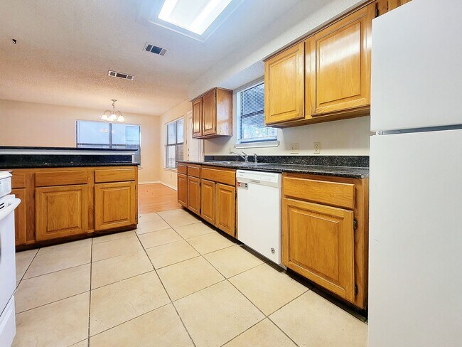 Building Photo - Warm & Inviting 4BR / 2.5BA Home with Covered Deck and 2-Car Garage